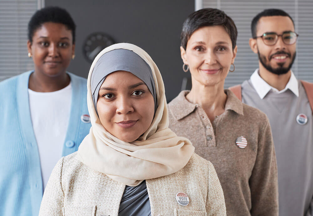 young-muslim-female-voter-in-hijab-standing-in-fro-47N8FXF.jpg